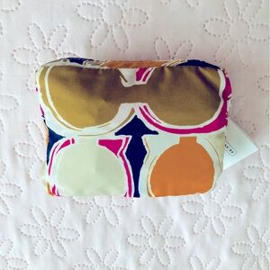 Coach Folding Tote F65940 Multicolor Fuscia, rust and tan colors. 3 1/2x7”